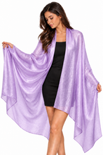 Load image into Gallery viewer, A woman modeling a shimmering lavender-purple open-front wrap or shawl over a black dress, shown against a plain white studio background.