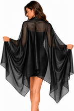 Load image into Gallery viewer, A woman wearing a sheer black high-low cape shawl pashmin wrap cover-up over a black dress, shown from the back against a plain white background.