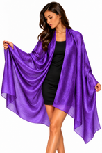 Load image into Gallery viewer, A woman modeling a sheer, flowing purple wrap or shawl draped over her shoulders, worn over a black dress, against a plain white background.