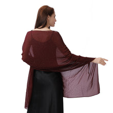Load image into Gallery viewer, A woman shown from the back wearing a sheer burgundy shawl with tiny gold polka dots over a black dress, set against a plain white background.
