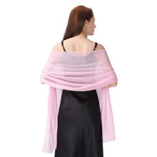 Load image into Gallery viewer, A woman shown from the back wearing a light pink sheer shawl draped over her shoulders, paired with a black dress, against a plain white background.