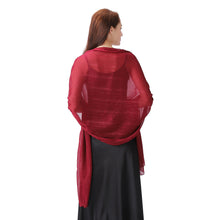 Load image into Gallery viewer, A woman shown from the back wearing a sheer, deep red shawl draped over a black dress against a plain white background.