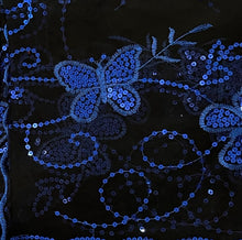Load image into Gallery viewer, Close-up of a black fabric featuring intricate royal blue sequined embroidery of butterflies, floral motifs, and swirling vine patterns.