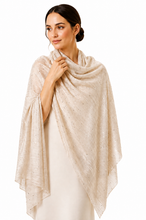 Load image into Gallery viewer, A woman wearing a light beige shawl with tiny scattered gold sequins, draped over her shoulders and neck, against a solid white background.