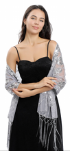 Load image into Gallery viewer, A woman modeling a black strapless dress with a sheer silver and grey sequined shawl draped over her shoulders, set against a plain white background.