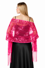 Load image into Gallery viewer, A woman shown from the back wearing a bright pink sheer embroidered shawl draped over her shoulders, paired with a black skirt, against a plain white background.