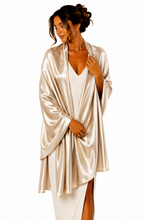 Load image into Gallery viewer, A woman wearing a shiny champagne satin wedding pashmina over a white dress, photographed against a solid white background.