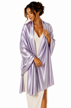 Load image into Gallery viewer, A woman modeling a shiny lavender satin pashmina over a cream dress against a plain white background.