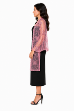 Load image into Gallery viewer, A woman shown in side profile wearing a sheer pink embroidered lace shawl over a black midi dress, paired with black heeled sandals, against a plain white background.