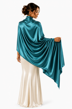 Load image into Gallery viewer, A woman shown from the back wearing a shiny teal draped pashmina over a cream satin dress, photographed against a plain light background.