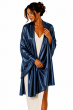 Load image into Gallery viewer, A woman modeling a shiny navy blue satin pashmina over a white dress, photographed against a plain white studio background.